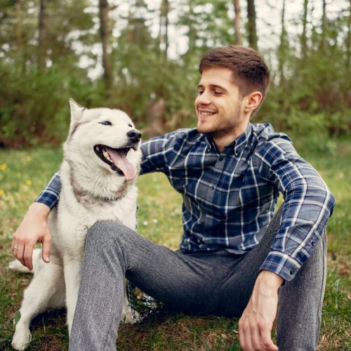 handsome-guy-in-a-summer-park-with-a-dog-2022-02-02-05-09-48-utc-min.jpg